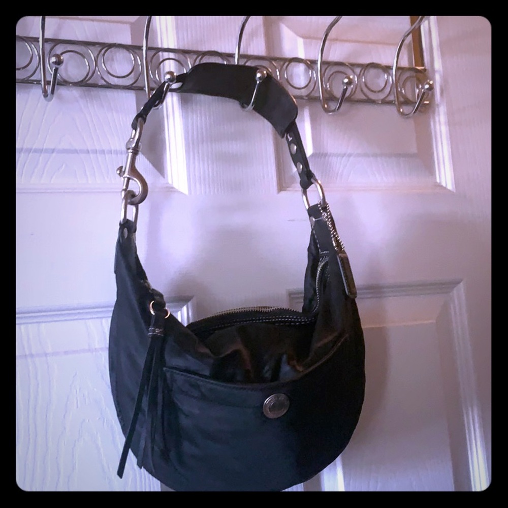 Coach black purse with turquoise inside Medium